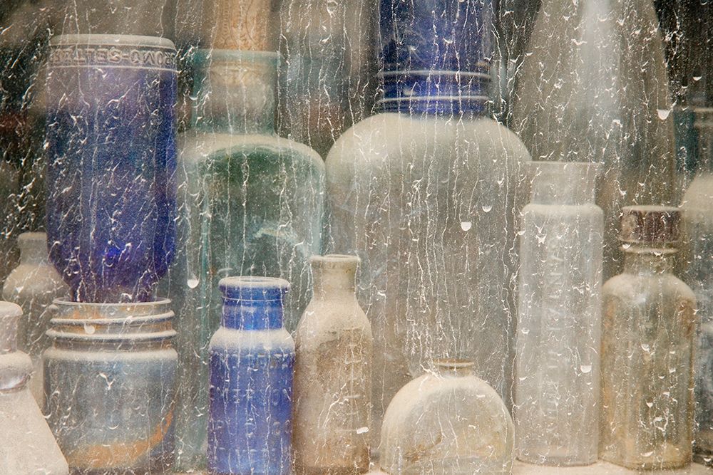 USA, Idaho, Idaho City. Old bottles in window.